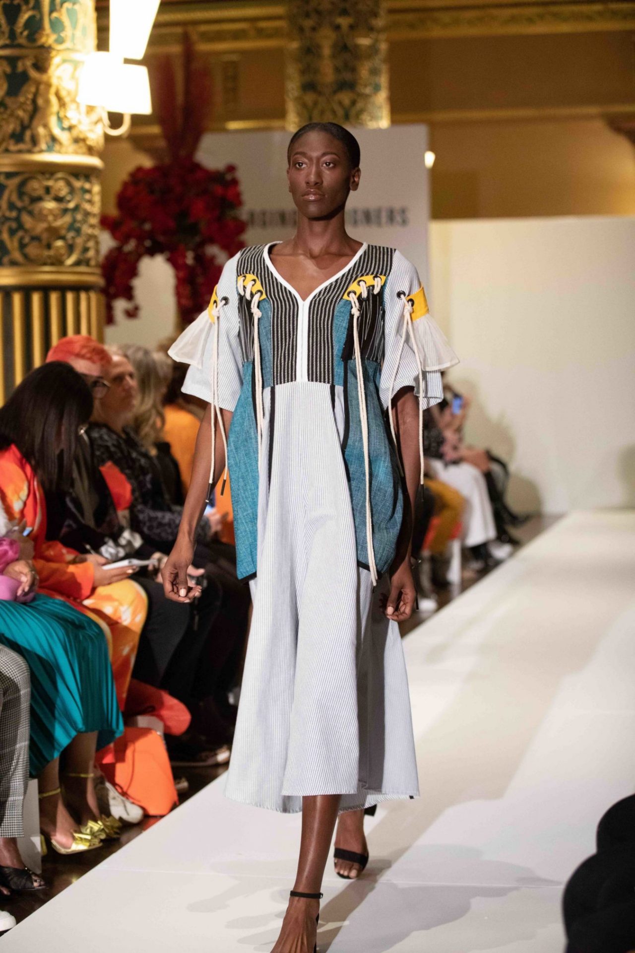 Model walks down the runway at NYFW