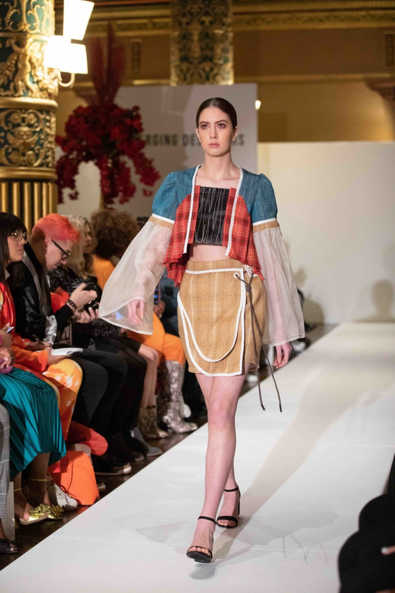 Model walks down the runway at NYFW