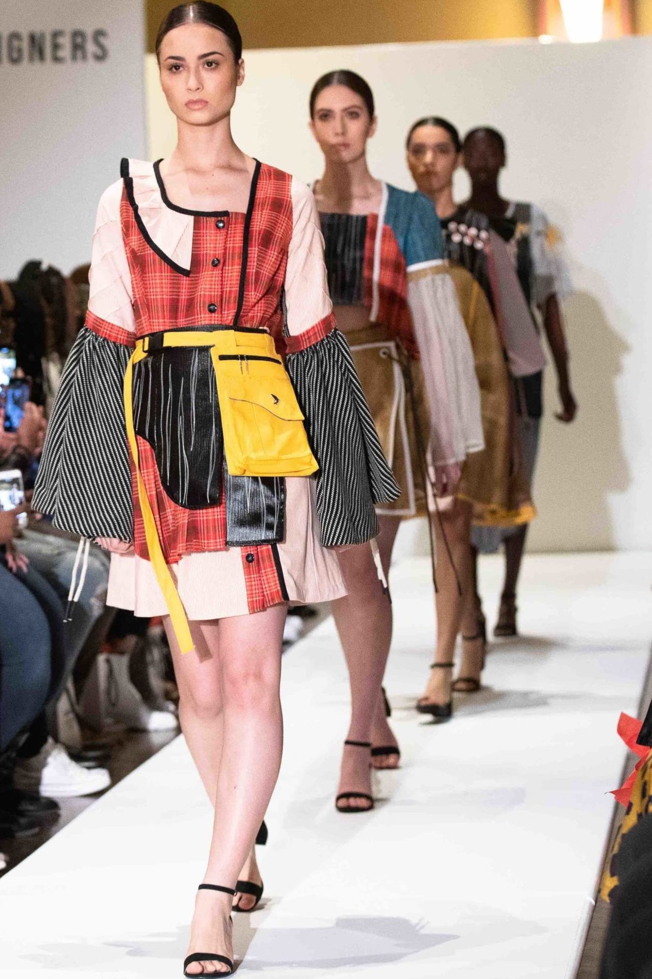 models walking down the runway