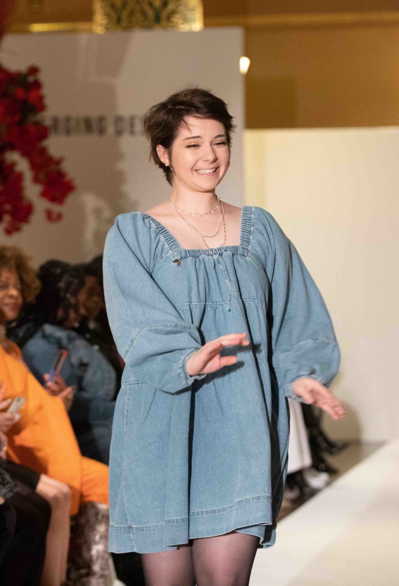 Student Robin Skodi walks down the runway.