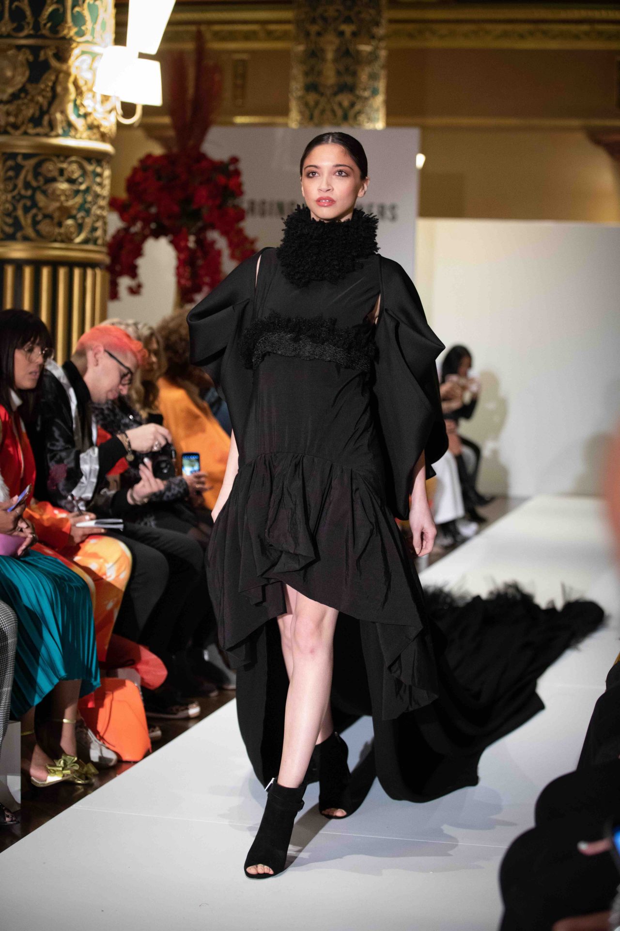 Model walks down the runway at NYFW