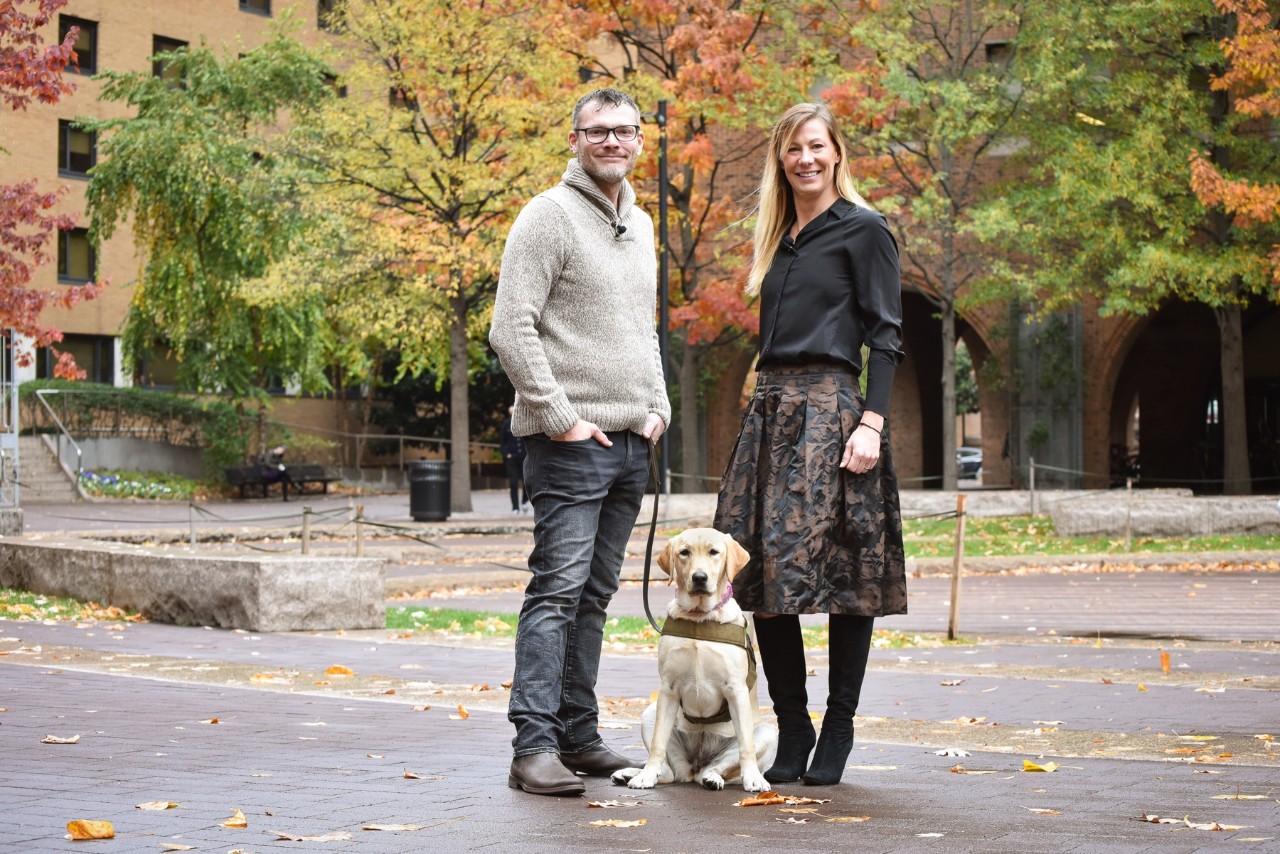 Jason Haag and Danique Masingill with the service dog in training Maggie