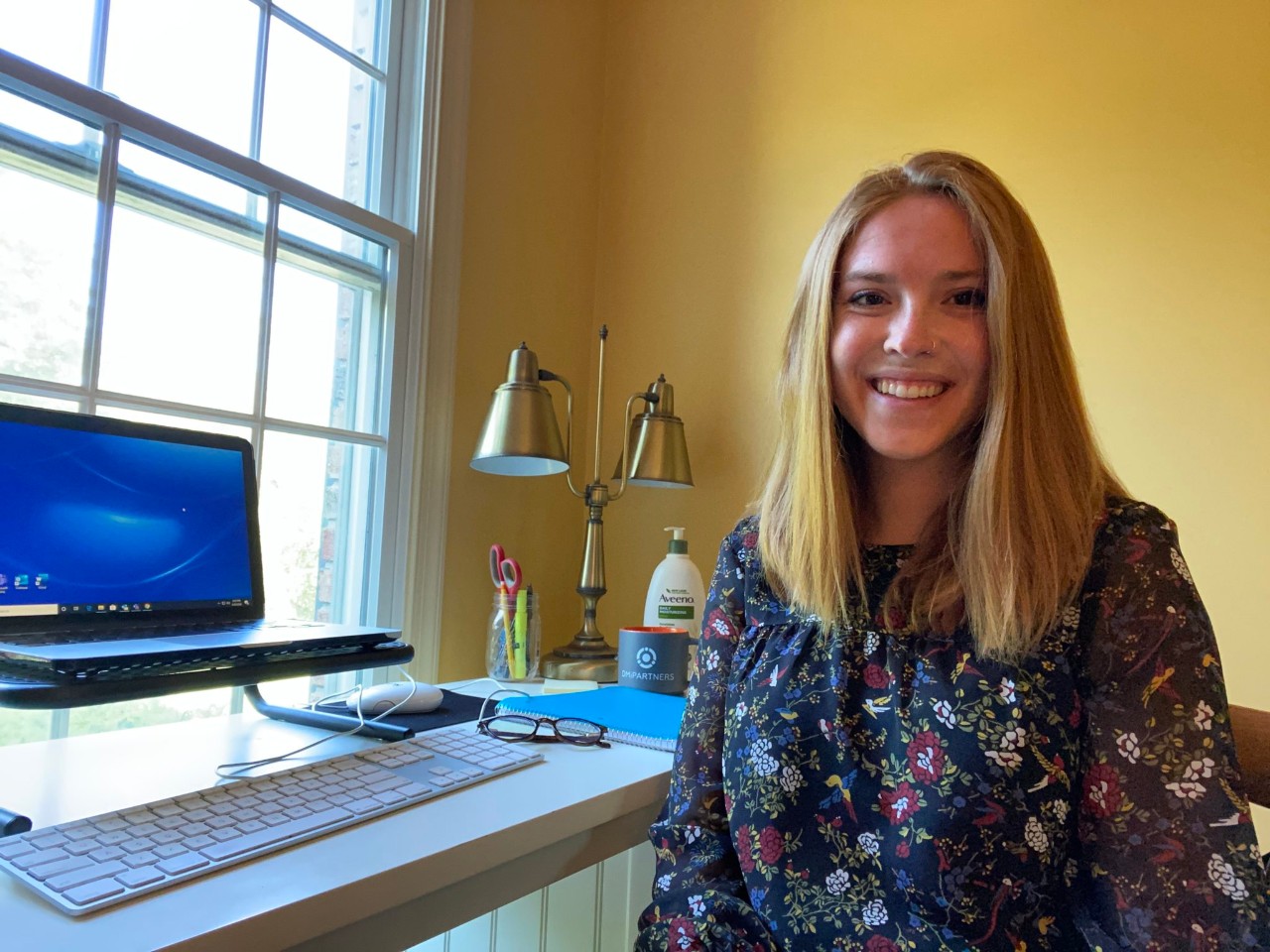 Ashlyn Allebach sitting at her home office