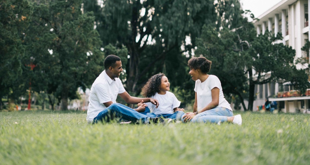 Family sitting in the grass