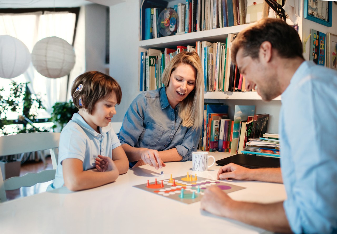 Family playing board game