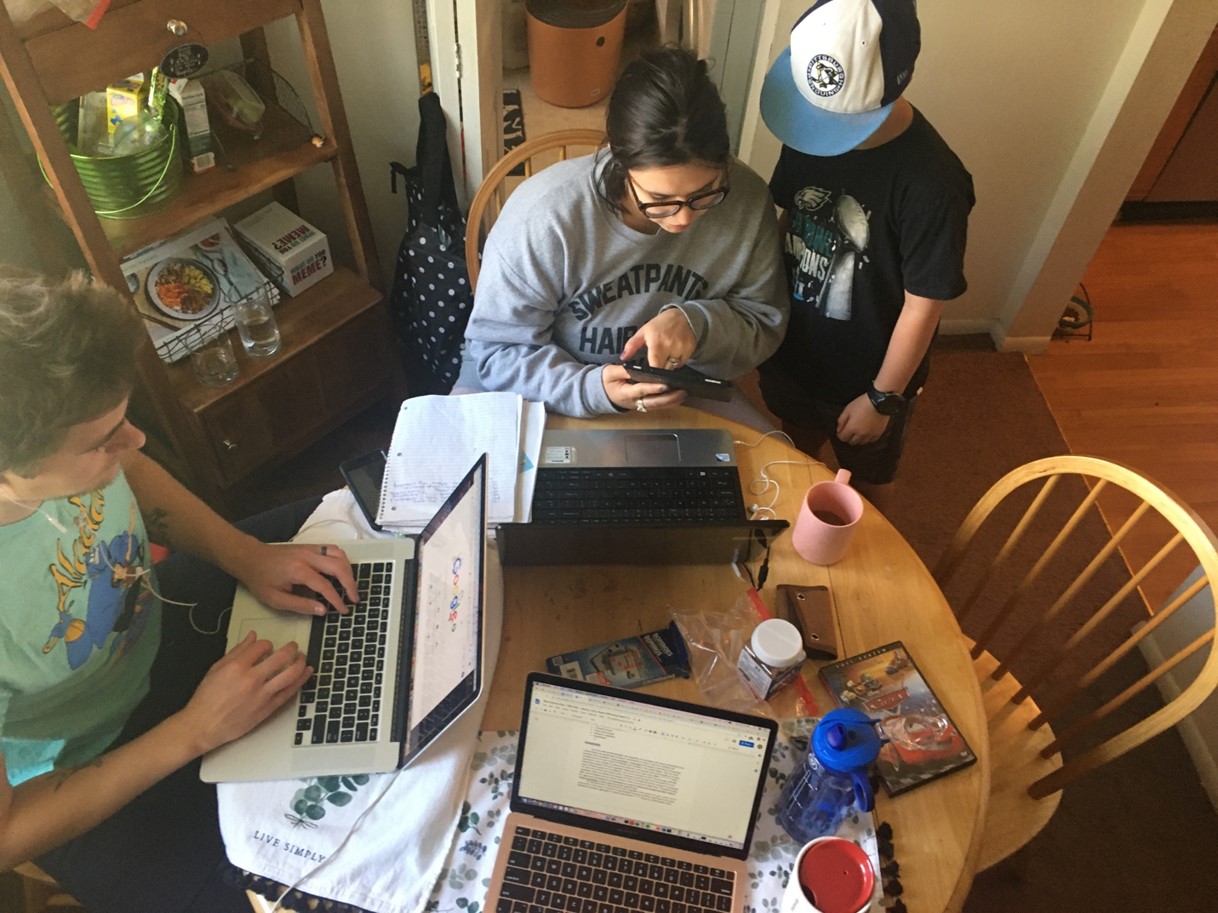 family working at kitchen table