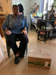 Katherine Butler receives a box of healthy food