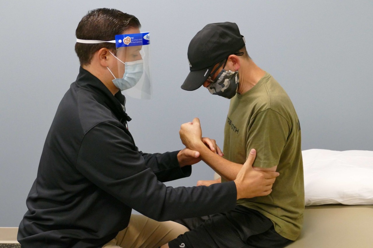 Joe Kardine OT working with Cortimo Patient Aaron Ulland