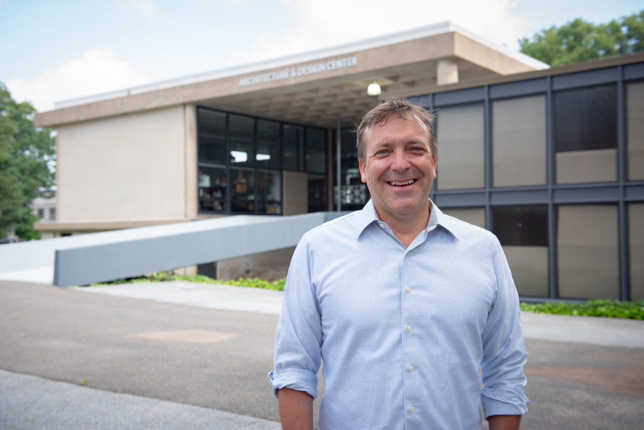 man standing in front of building