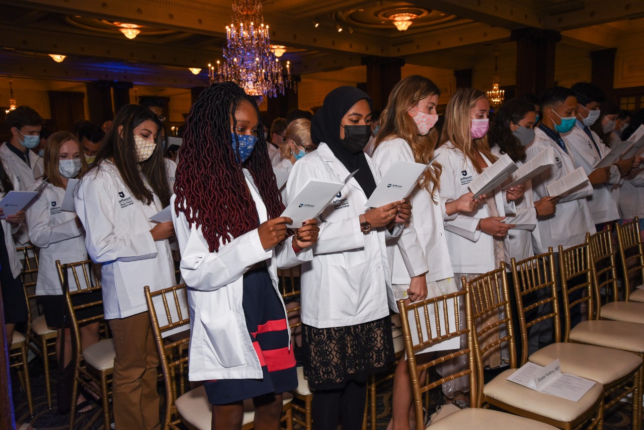 Students reading the oath