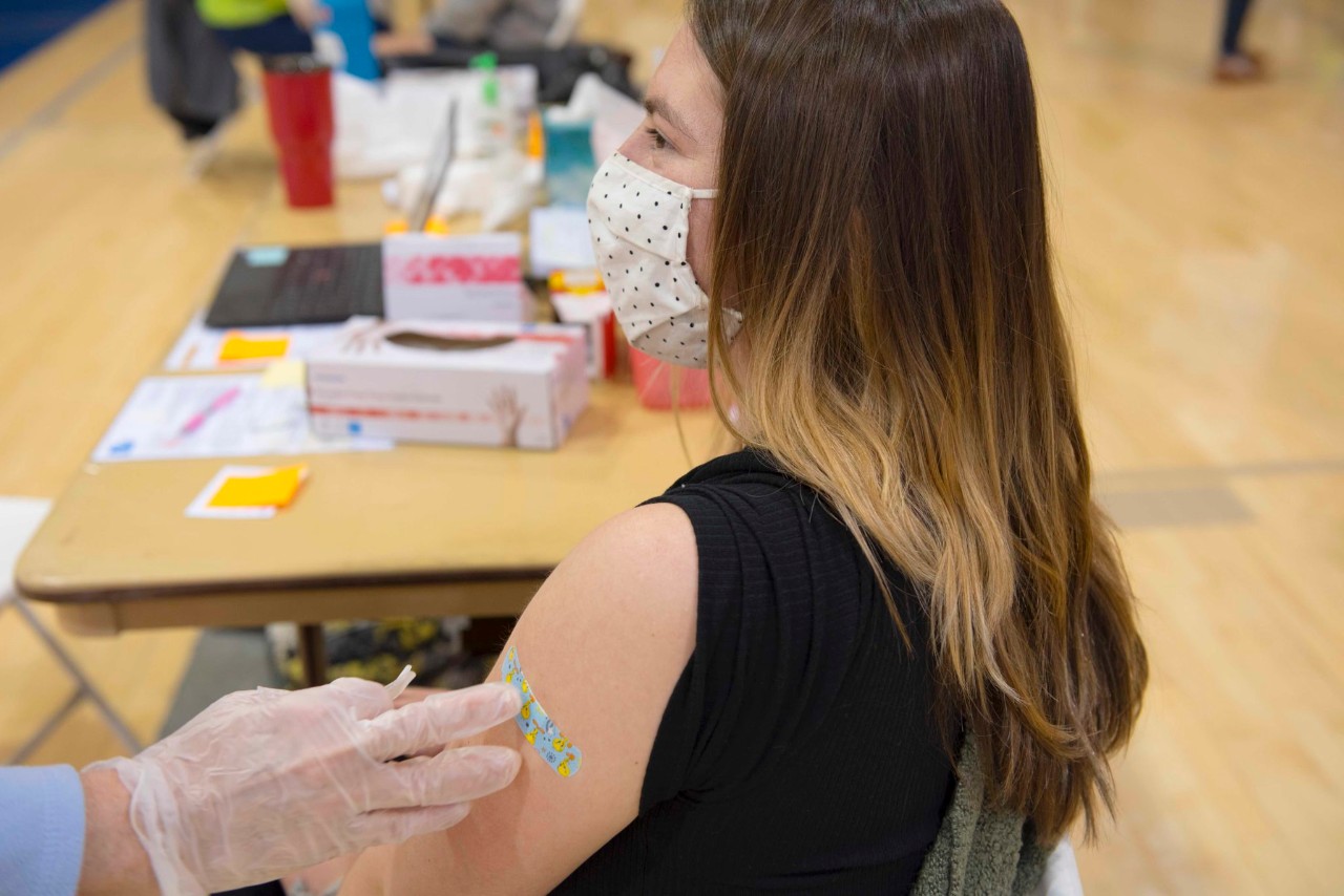 student receiving her covid vaccine