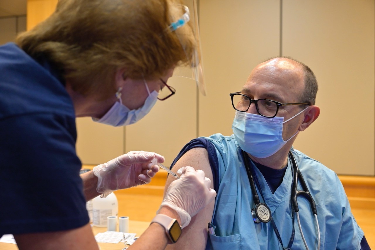 Dr. John Russel receiving his vaccine in December 2020.