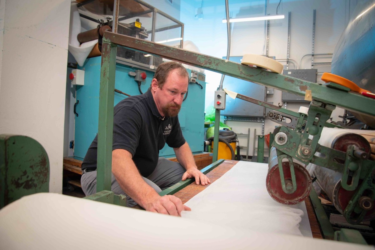 Dr. Brian George working on the fabric