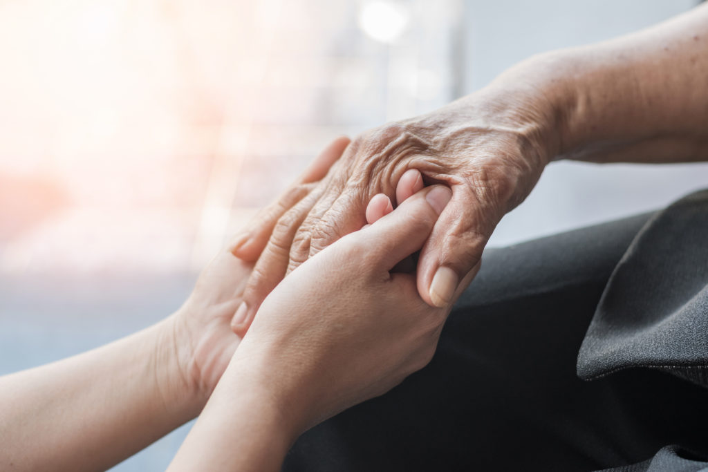 Two people holding hands