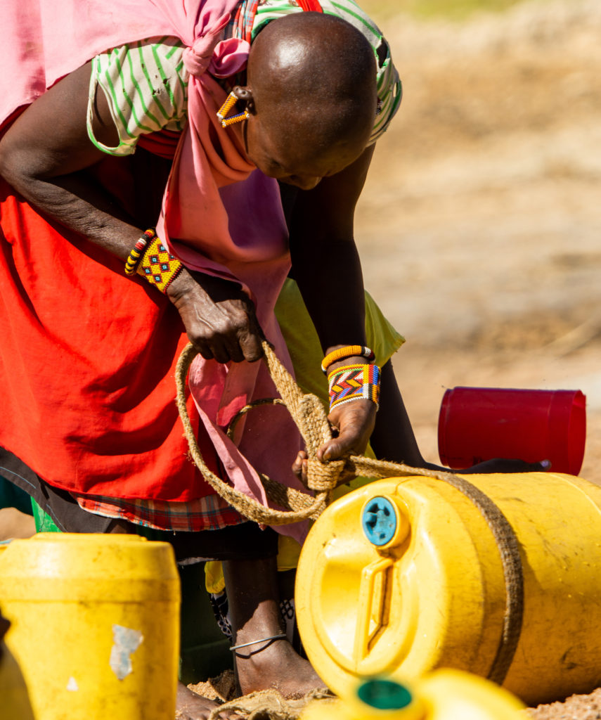 Adult collecting water