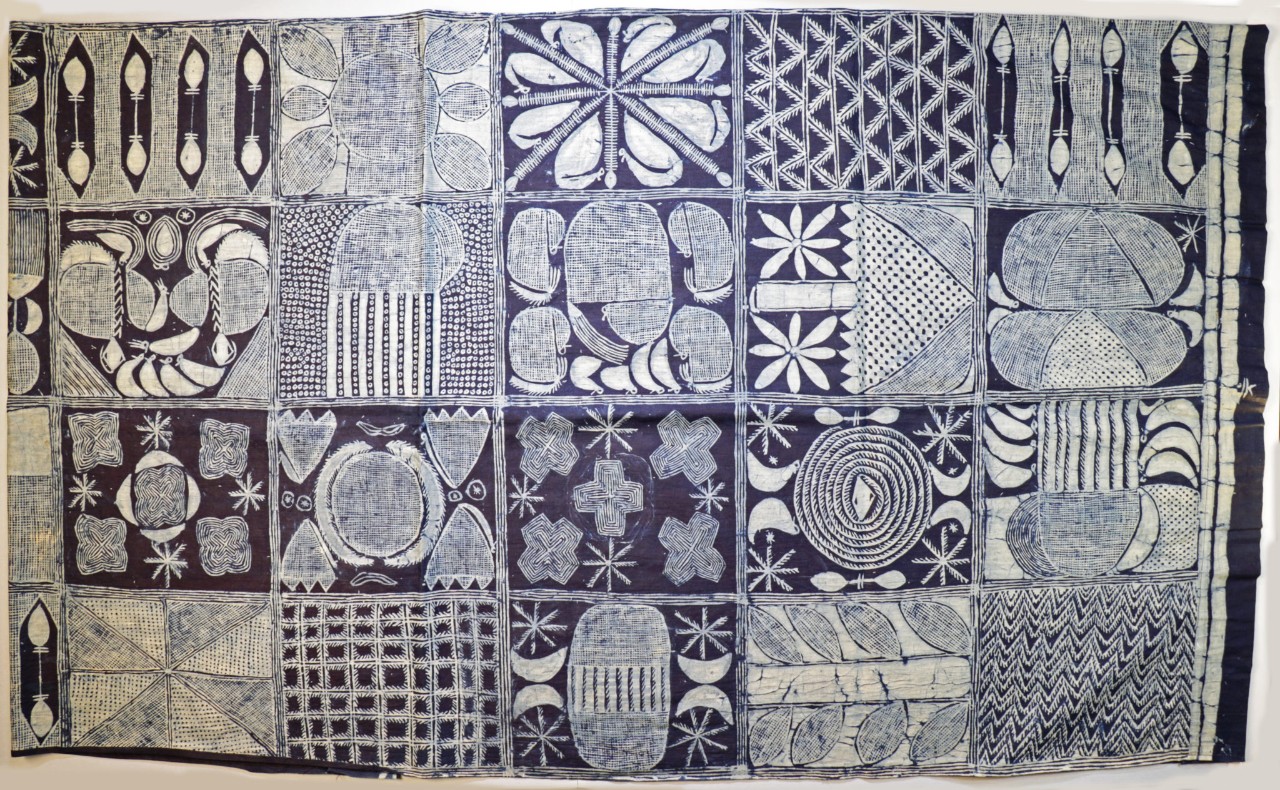 The collection includes this indigo resist dyed cloth from Yorubaland, Nigeria. The resist is created from starch made from cassava flour, which is applied via stencil or paint.