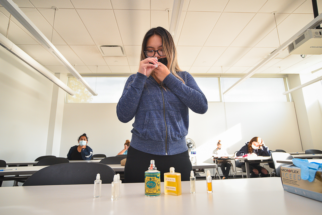 Student smelling perfume