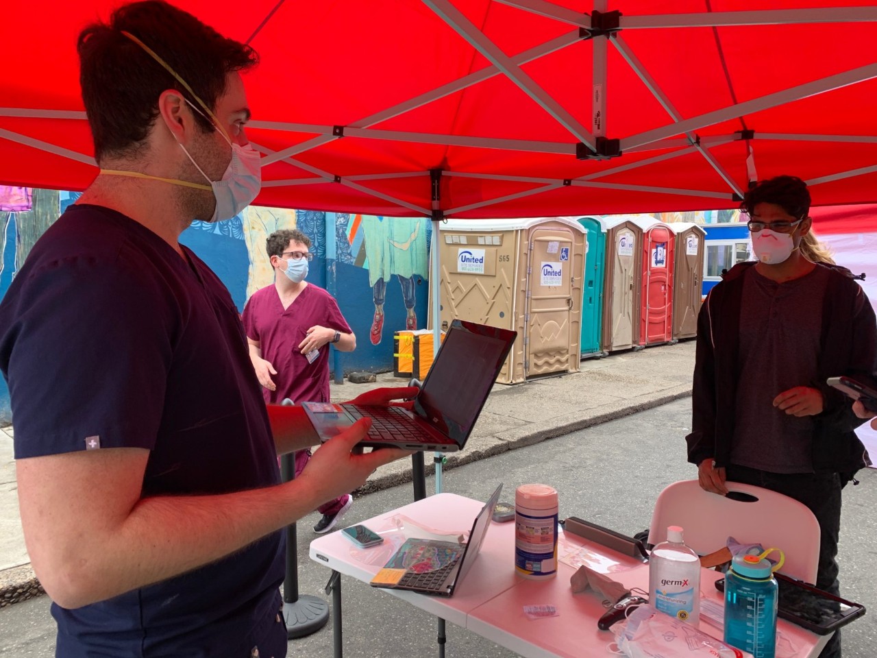 Students at our outdoor hybrid clinic at Prevention Point Philadelphia Left to right: Adam Cohen-Nowak (MS4), Husayn Siddiqui (MS4)