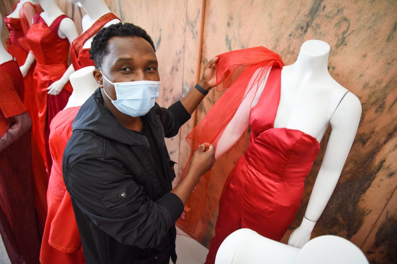 Student posing with red dress