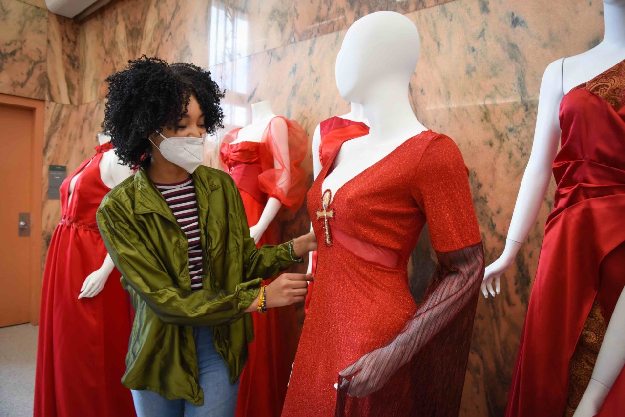 Student posing with her red dress