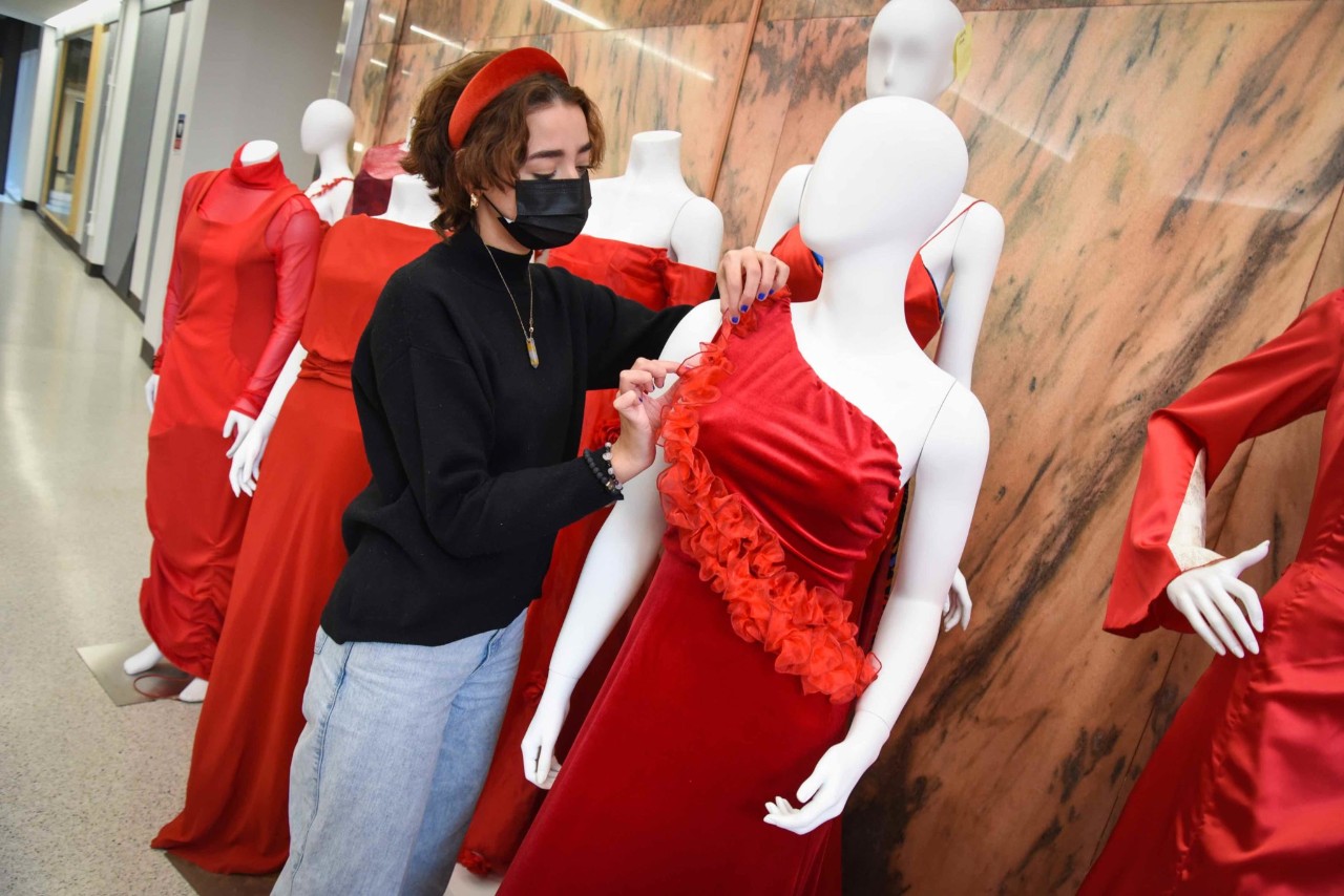 Student posing with her red dress