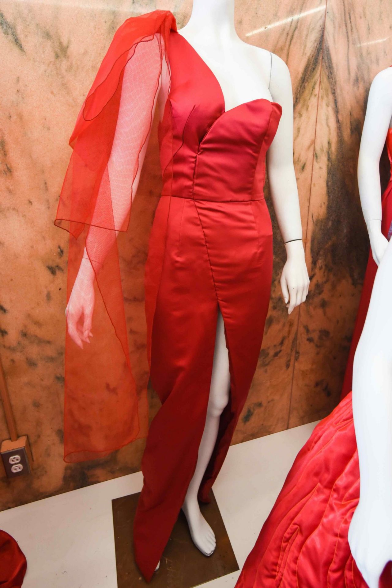 Assim De Gabriel, “Emotions and Heart” This red dress for fall/winter 2022 tells the story of humanity as defined by trueness, lust and desire. This dress project is a great opportunity for me to show support for all women through my creativity as a fashion designer and creative artist. I hope my story conveys love and challenges. This dress was created to raise awareness for heart health in both women and men. This fashionable dress is for every woman who likes to be elegant and to enjoy social events for great causes in the community.