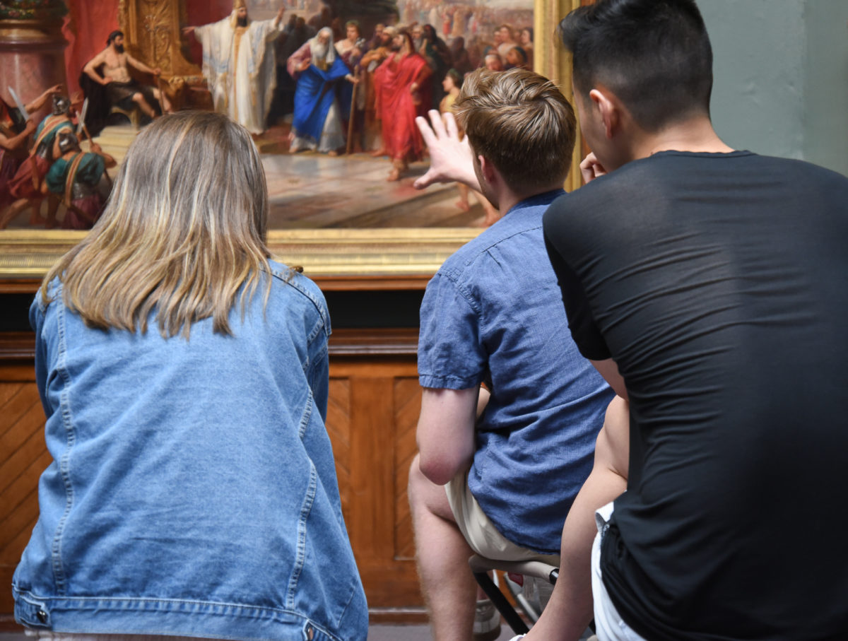 Med students looking at art work