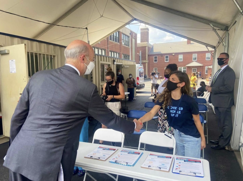 Eva Varotsis welcomes Pennsylvania Governor Tom Wolf at a Jefferson Vulnerable Community Mobile COVID-19 Vaccine Clinic in Philadelphia.