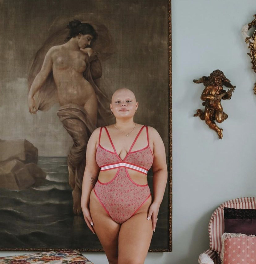 Maddie modeling in front of a painting