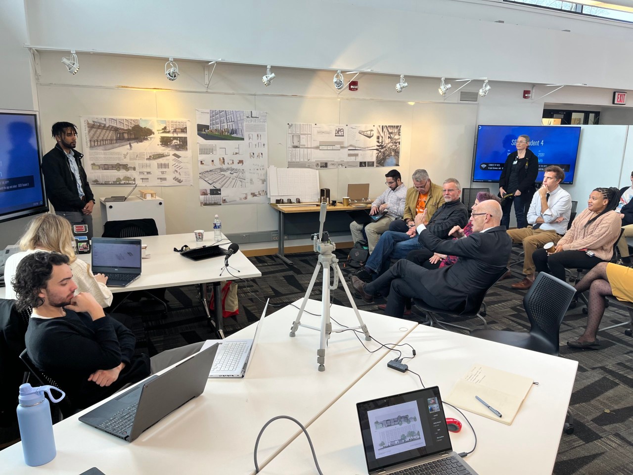 Caption: Architecture and Physical Therapy students present their projects to faculty and classmates. (Photo by Professor David Kratzer)