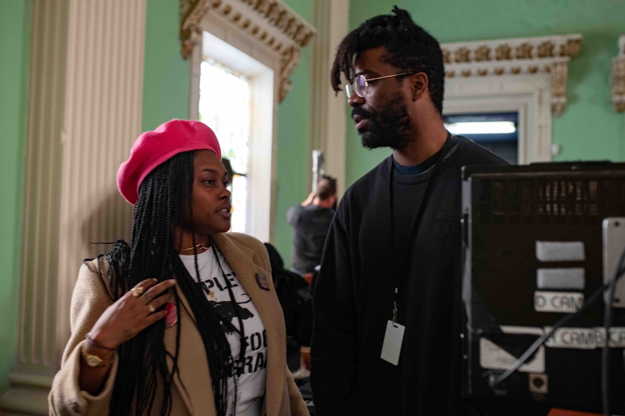 Charlese on set of Judas with director Shaka king
