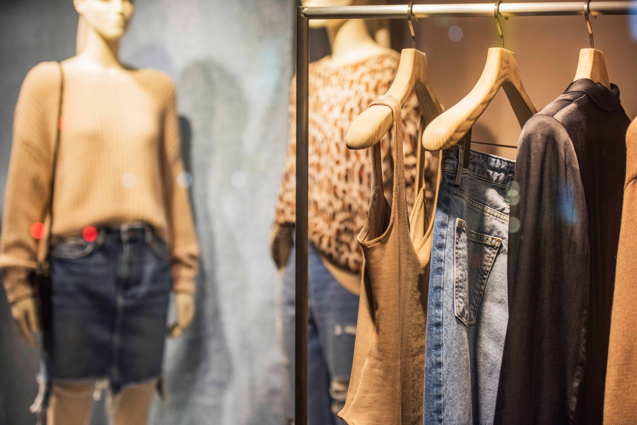 Women's clothes on racks in a store