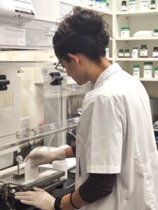 Dr. Martinez makes capsules for one of her patients.