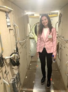 Gabrielle Zimmerman tours one of the space vehicle modules at the Space Vehicle Mockup Facility.