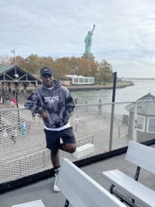 Fils Iragena in front of the Statue of Liberty