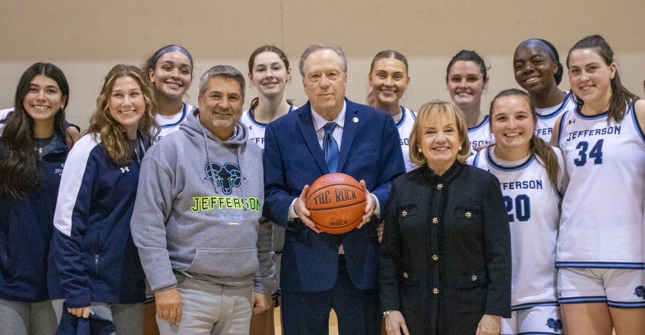Coach Tom Shirley with Joe Cacchione, Susan Aldrich team and staff