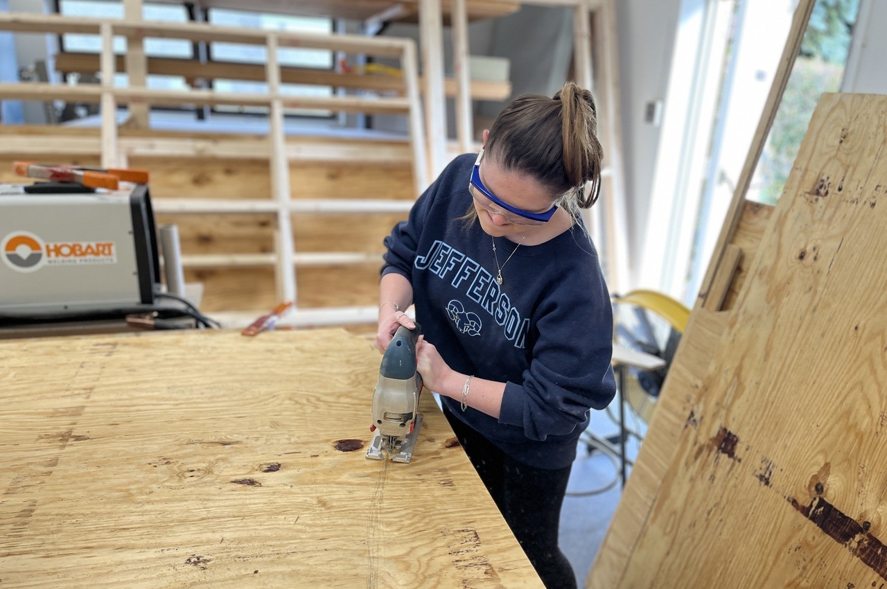 Interior design student Kelly Harrington works on an installation.