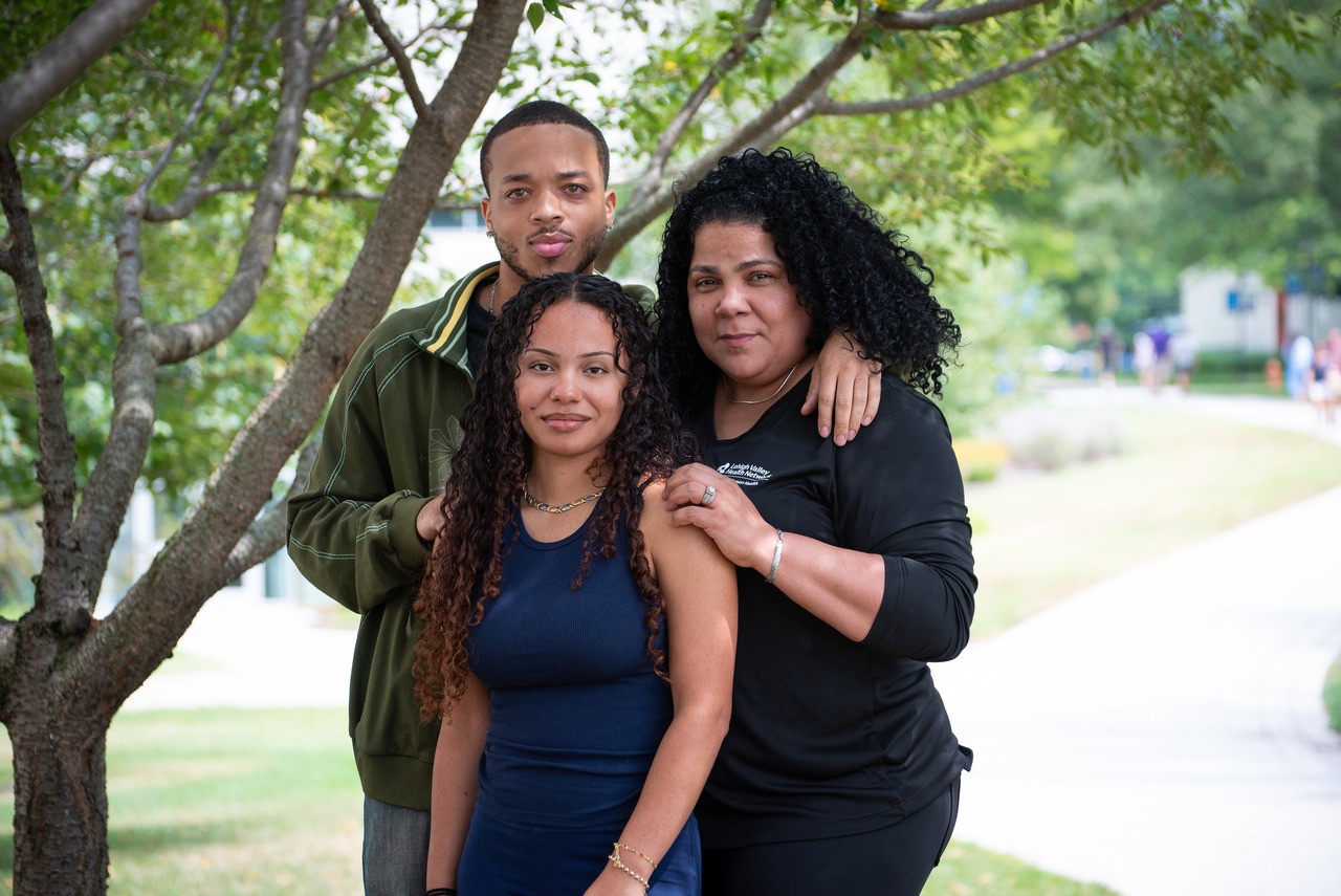 Architecture student Jaqueline Vega—pictured with her boyfriend, Donnell Wilson, and mom, Missy Vega—worked at Lehigh Valley Health Network as a nursing unit clerk. 