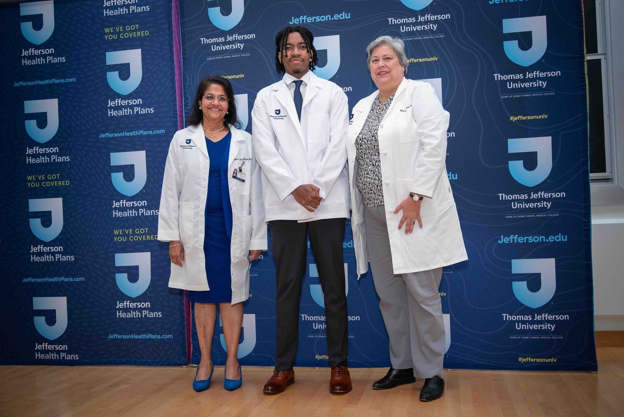 Pharmacy student Masoud Salim received his white coat from Drs. Anandi Law and Mary Hess. 