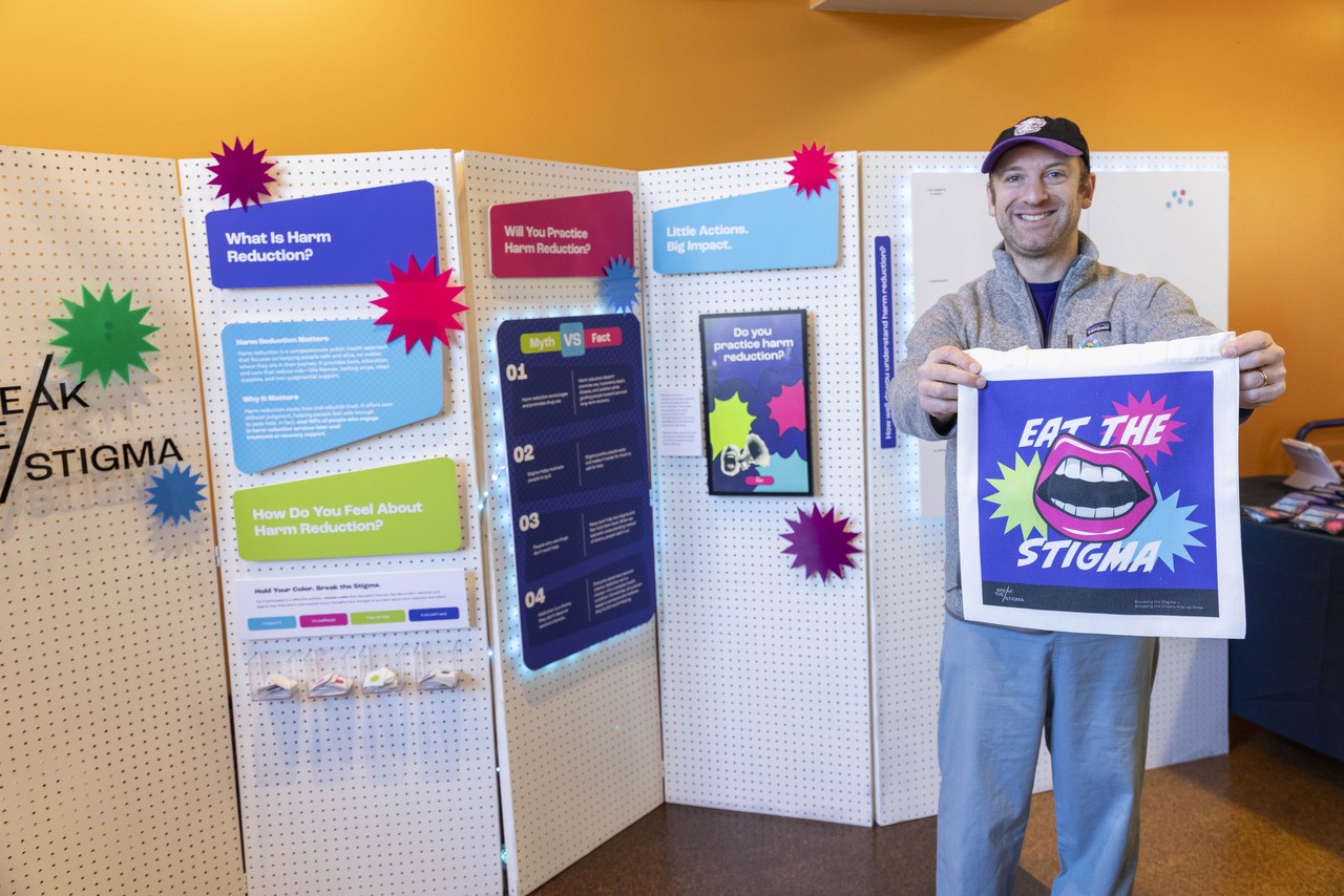 Sidney Kimmel Medical College faculty member Dr. Gregory Jaffe holds a branded tote bag created by visual communication design students. (Photos by Steve Belkowitz)
