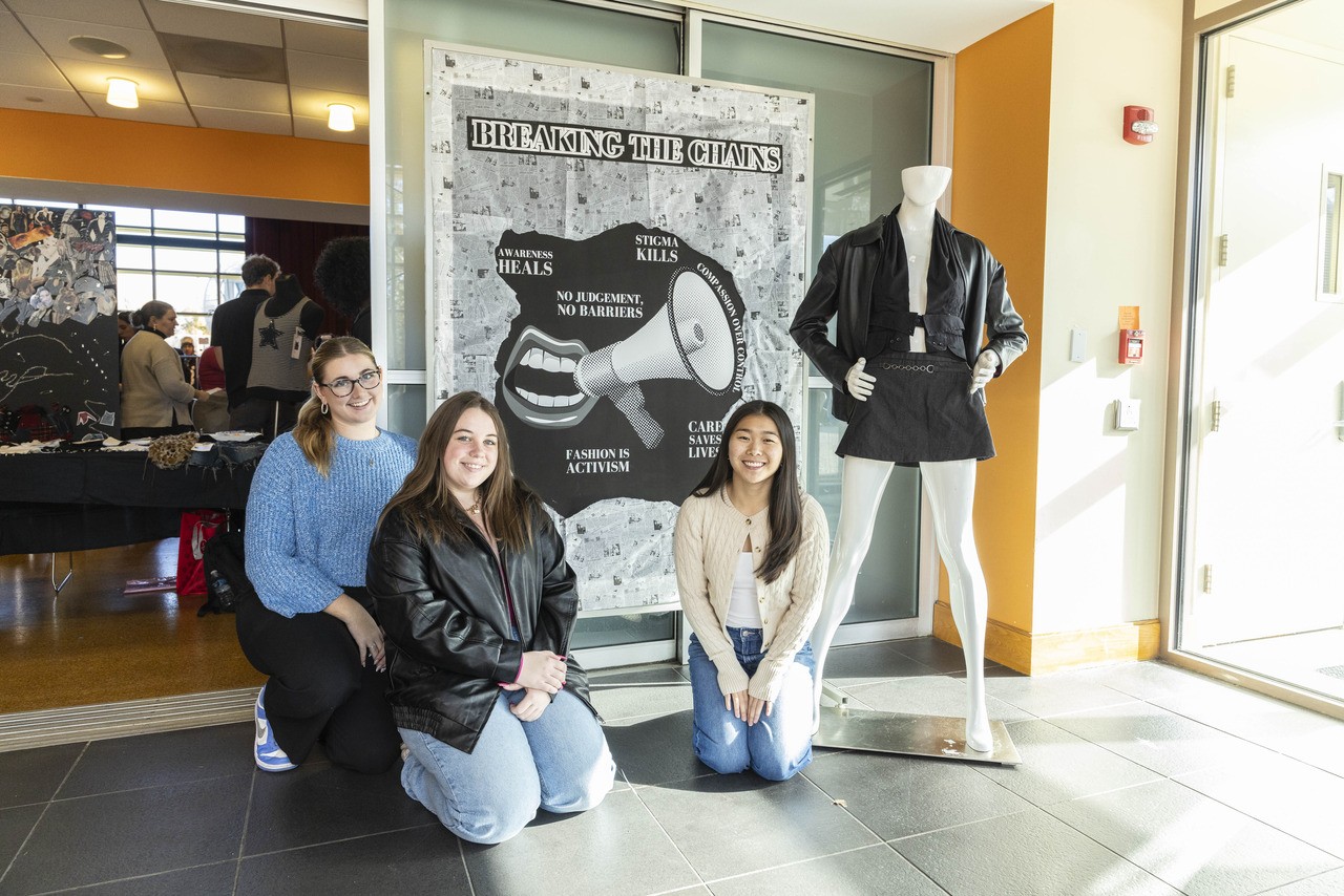 Fashion students in the Visual Merchandising class (l-r) Cassidy Dormer, Sarah Ries and Gracie McMahon designed visuals for windows and in-store displays for the pop-up shop.