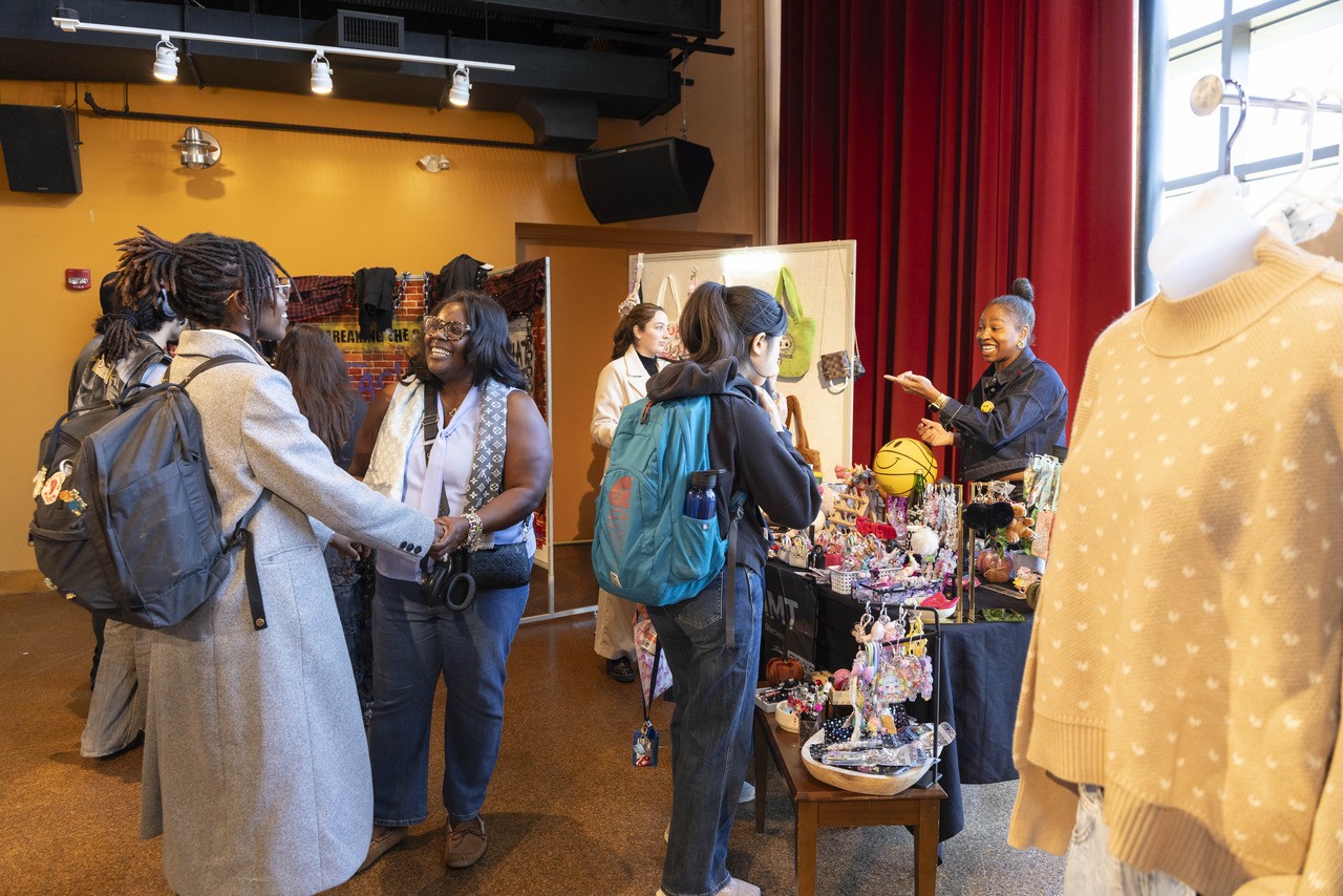 Alumna and fashion merchandising faculty member Jeneene Bailey-Allen (right) was among the seven entrepreneurs with tables at the event. “The pop-up shop cultivates everything that we teach them about the real world,” she says.